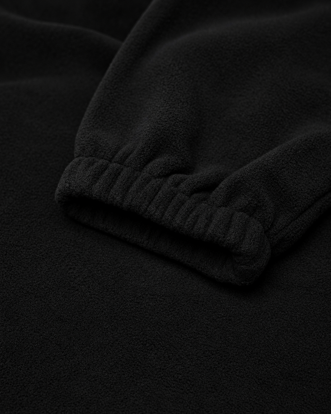 The Nations Fleece in Black, elasticated cuff detail