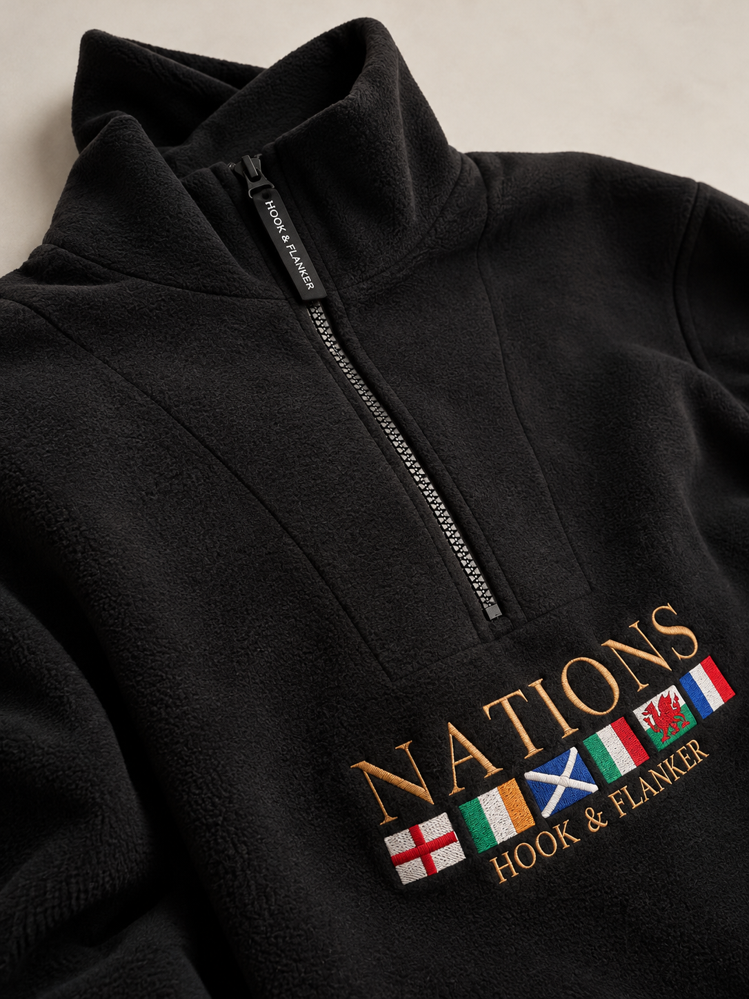 The Nations Fleece in Black, embroidered crest detail