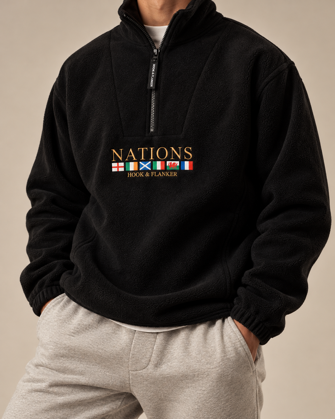 The Nations Fleece in Black, worn with grey joggers