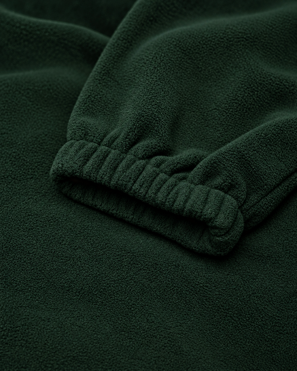 The Nations Fleece in Forest Green, elasticated cuff detail