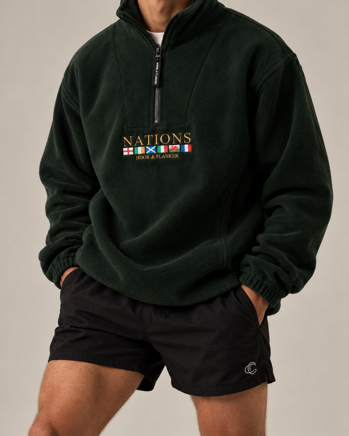 The Nations Fleece in Forest Green, worn with black shorts